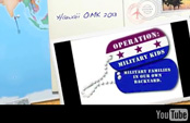 Operation Military Kids dogtags sitting on map of Pacific